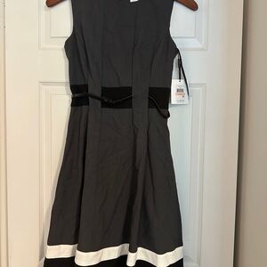 Elegant Gray Sleeveless Dress with Black and White Accents